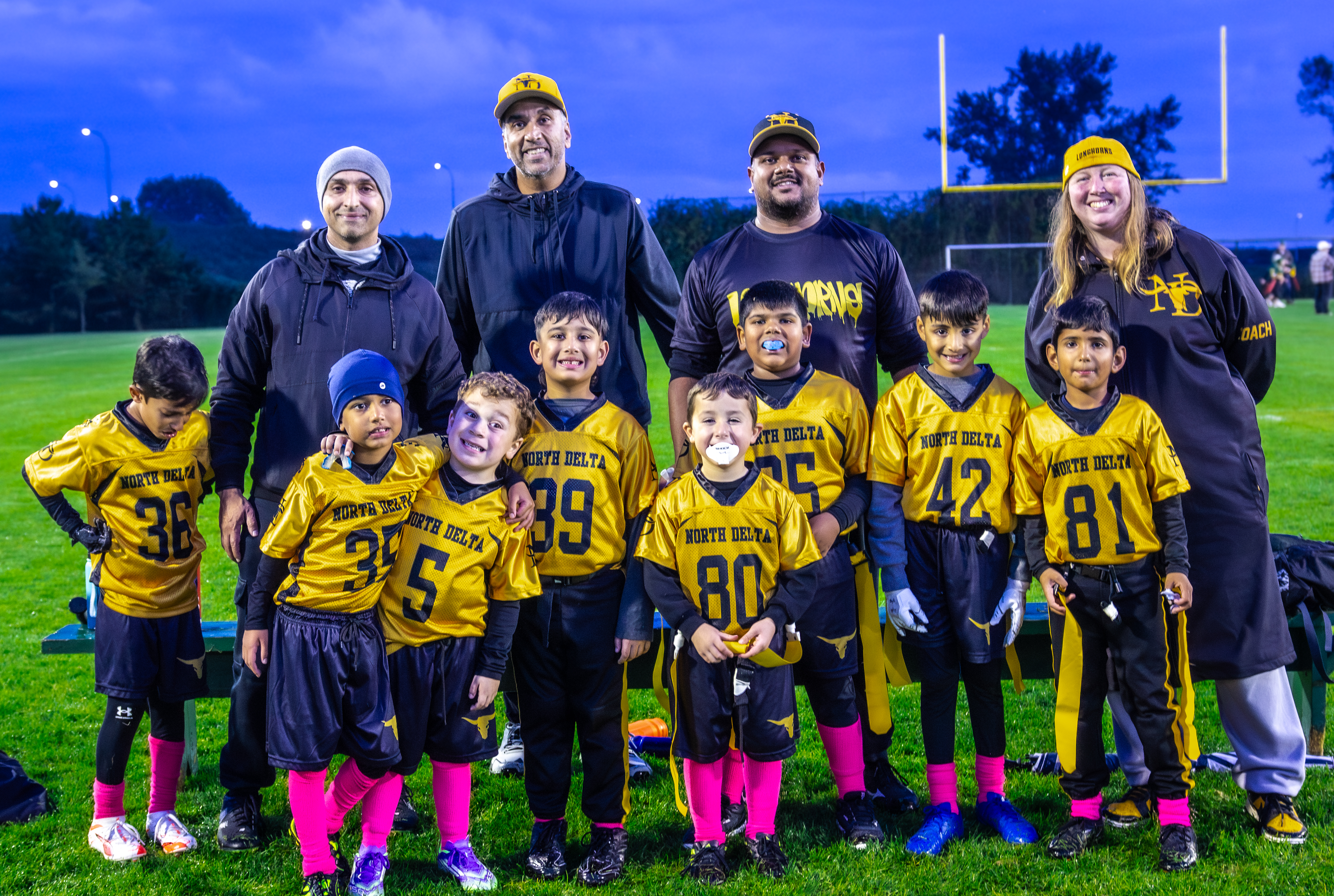 Atom division team photo with coaches — North Delta Longhorns